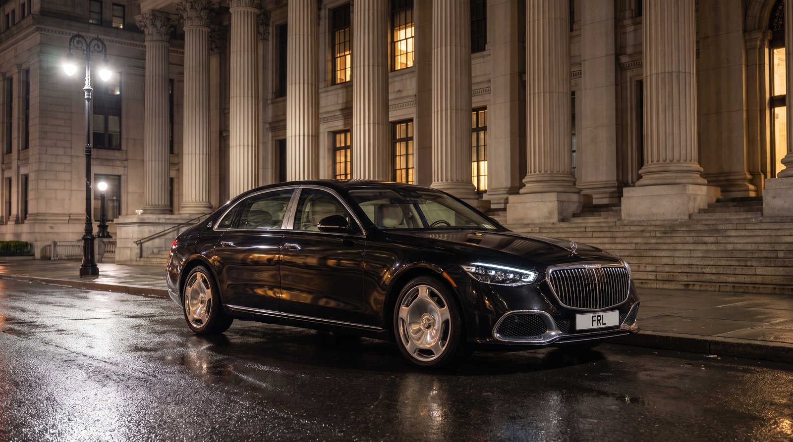 Current-model Mercedes-Maybach outside a government building at night