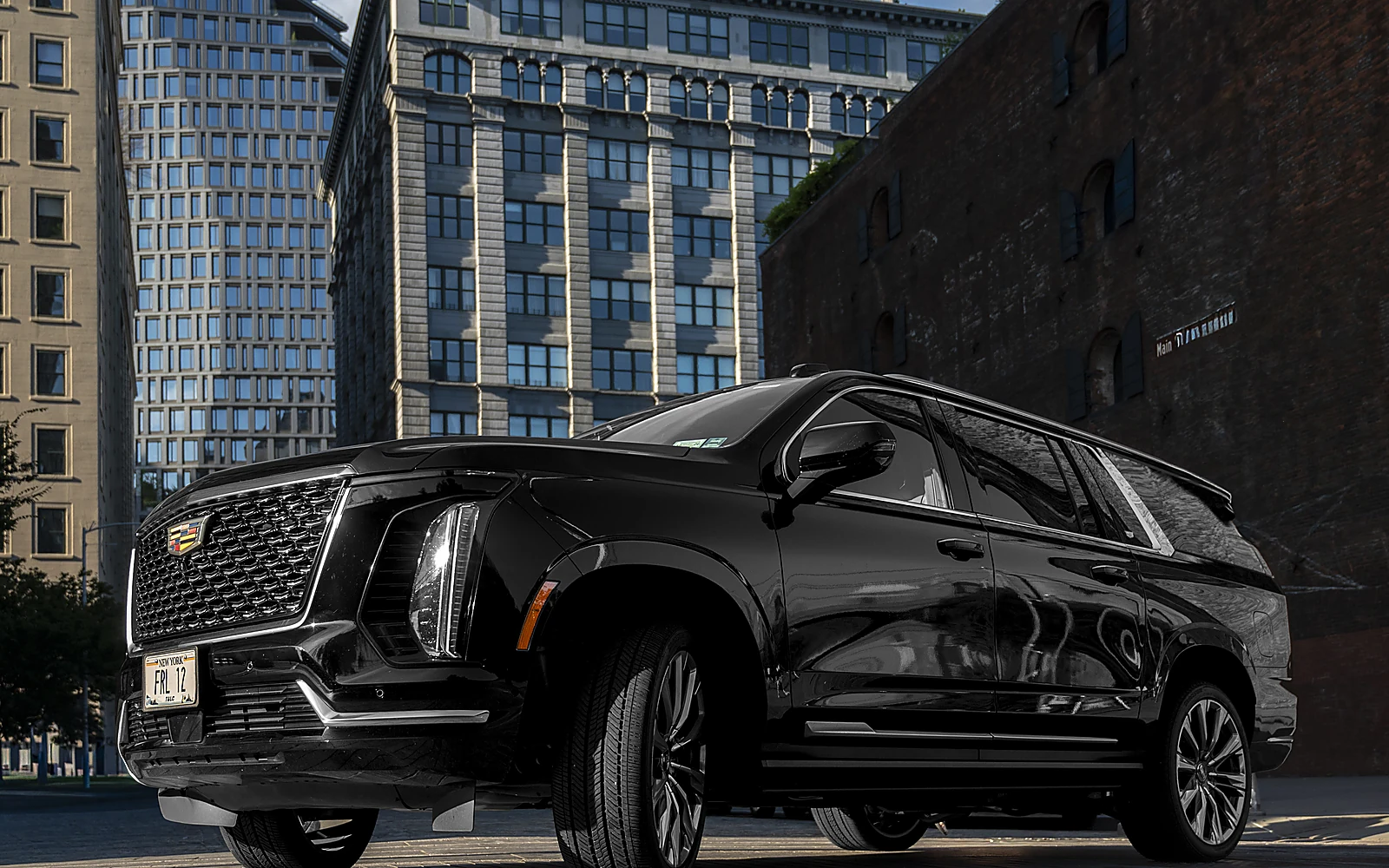 Cadillac Escalade ESV, front three-quarter, black exterior