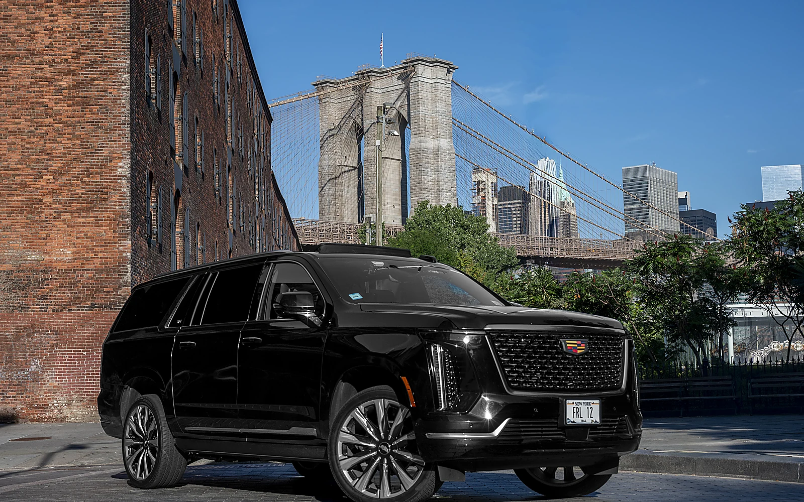 Cadillac Escalade ESV, front three-quarter with bridge backdrop