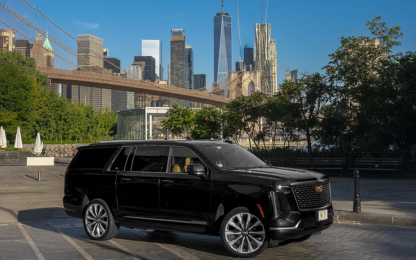 Cadillac Escalade ESV, side profile with city backdrop