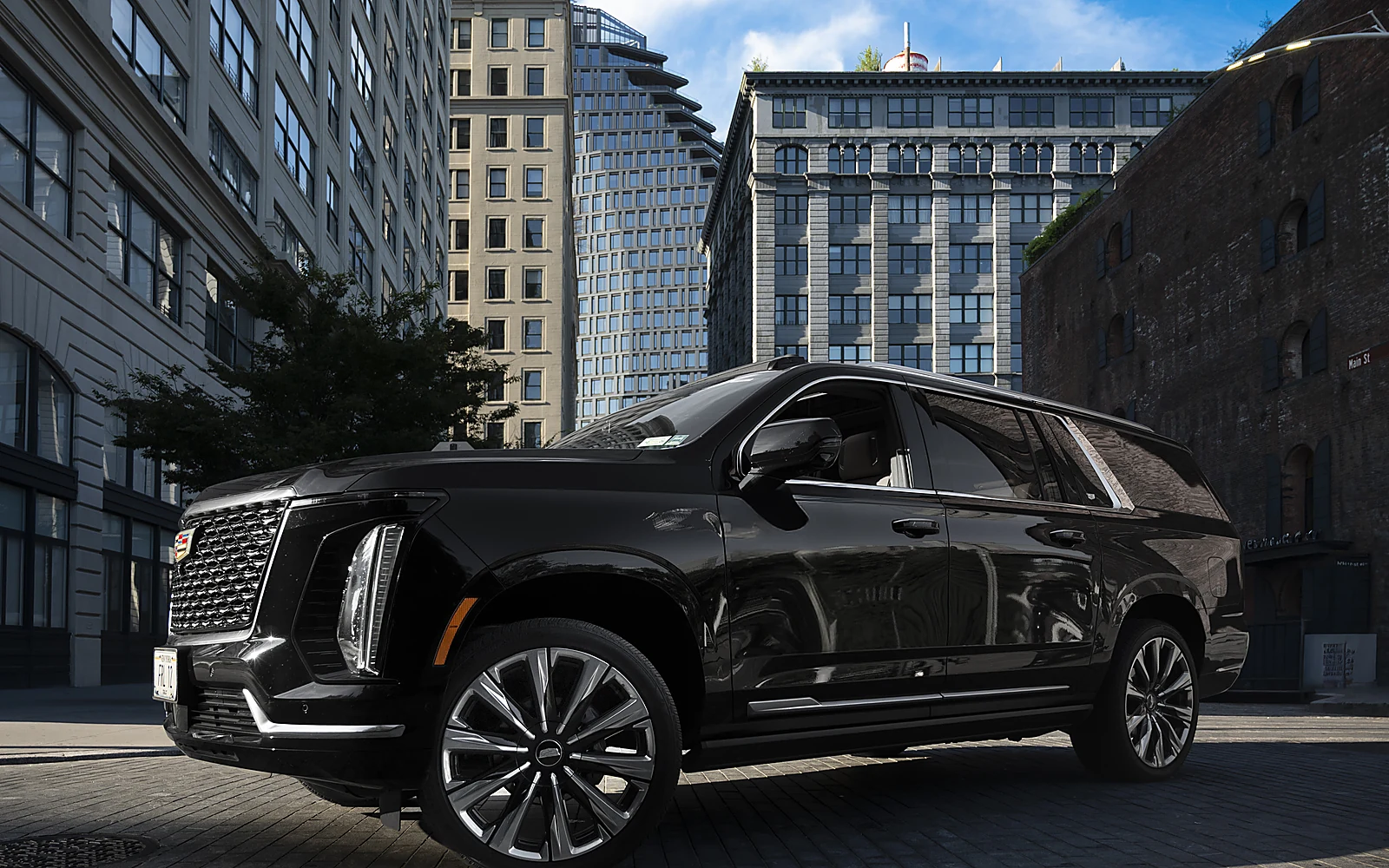 Cadillac Escalade ESV, side profile on a city street
