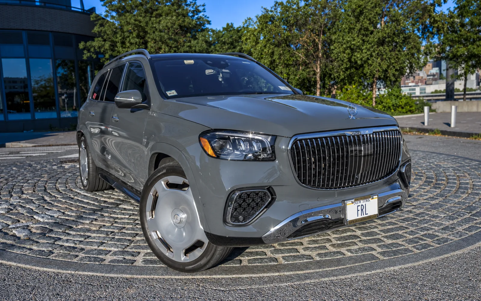 Mercedes-Maybach GLS 600, front three-quarter with city backdrop