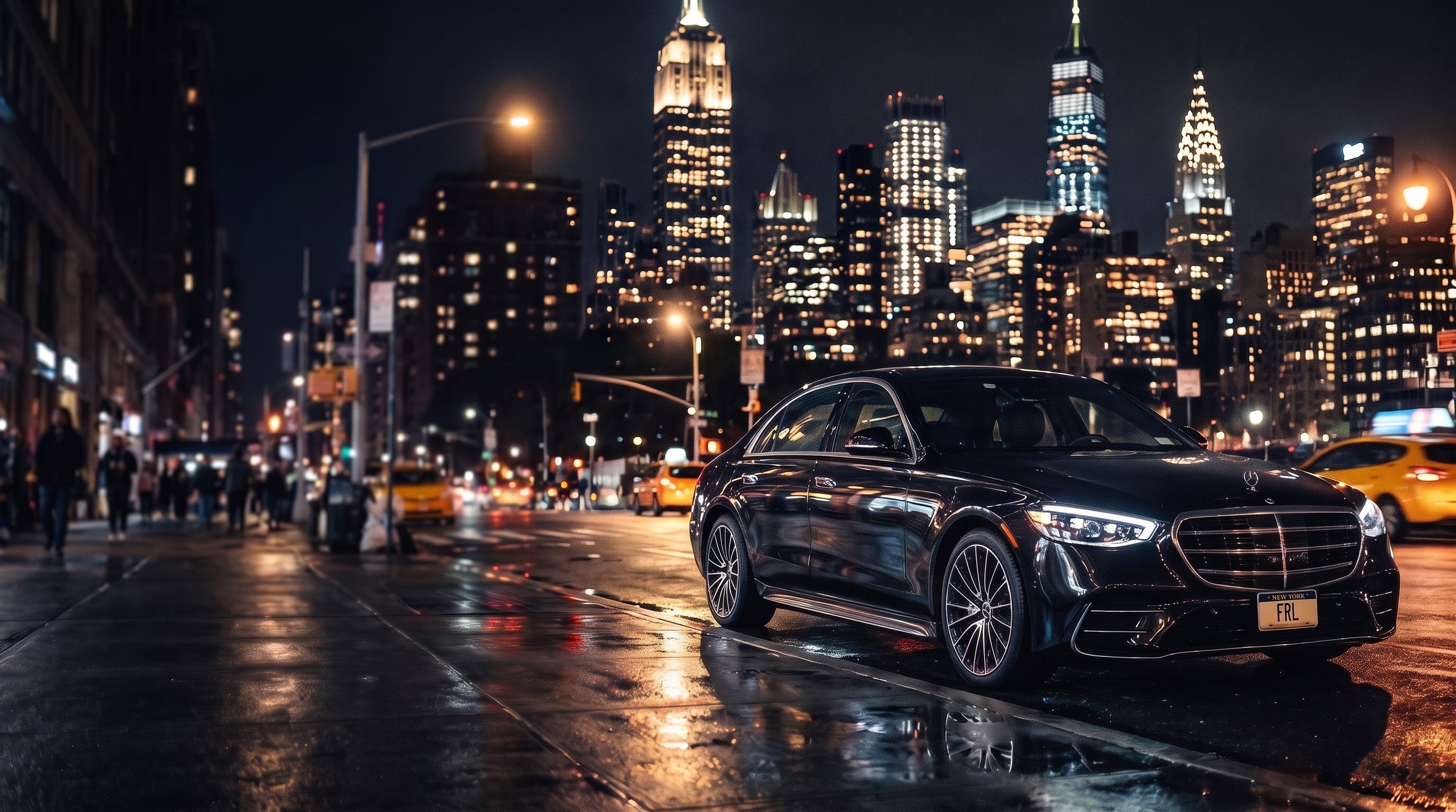 Black Mercedes-Benz S-Class on a Manhattan street at night, Empire State and Chrysler Building in the background