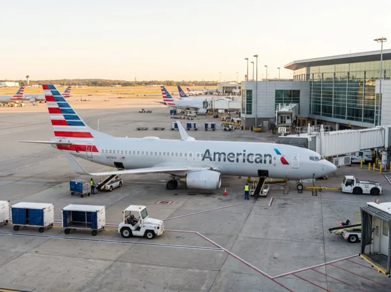 American Airlines aircraft at an international airport terminal gate