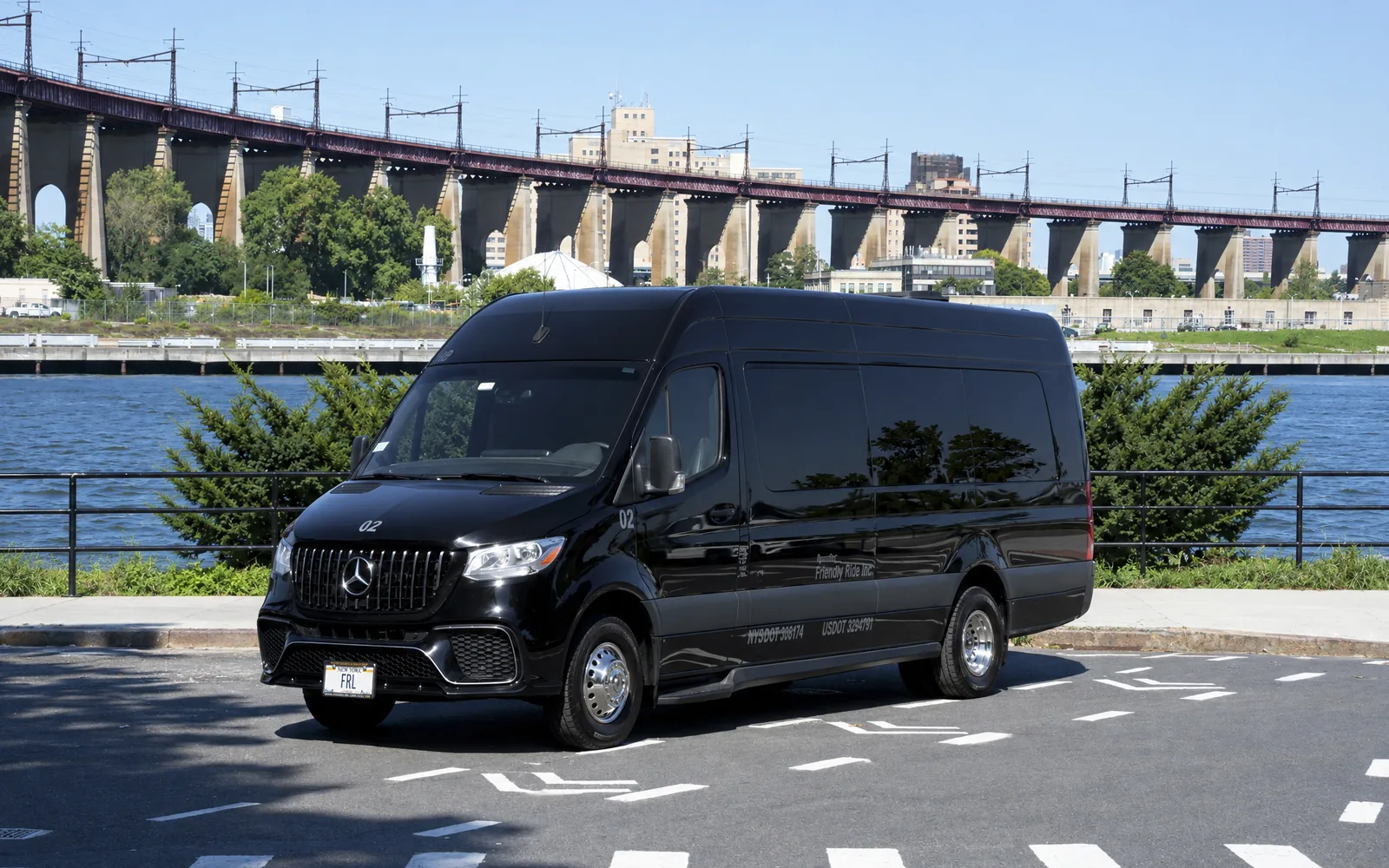 Mercedes-Benz Sprinter Limo, front three-quarter with bridge backdrop